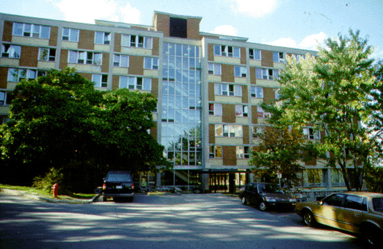 The upper residences are situated among the trees in Macdonald Park, a parcel of land on Mount Royal donated to McGill in 1911 by Sir William Macdonald, a major benefactor of the University. All of the residences except Royal Victoria College are located in Macdonald Park and are quite removed from the noise and commotion of the city. Originally, all of McGill's residences were designated for men with the exception of the Royal Victoria College, which was reserved for women. Today, RVC remains a women's residence while all of the other residences are co-educational. The upper residences, built in 1961 by the firm of Durnford, Bolton, Chadwick and Ellwood, consist of three separate housing buildings which surround a dining building. McConnell, Molson, and Gardner Halls are identical and provide housing for 672 students all together. Each seven-storey hall is split into two wings by a central stair and elevator core. Approximately thirty-six students are housed on each floor in single rooms, men in one wing, women in the other. There is a kitchenette on every floor and two large, common bathrooms, one per wing. Every room has cement block walls, a large window, and is equipped with built in furniture. There is a large common area, a television room, a study room, and a games room on the ground floor of each hall, and a laundry room in the basement. Other recreation is easily accessible because of the proximity of the Gymnasium and Stadium, tennis courts, the Winter Stadium, the Forbes' Field, and Mount Royal. The exterior of these three halls is of brick, tile, and cement, alternating in regular patterns to allow a window in every bedroom. The entire central stairwell of each building is encased in glass.

Bishop Mountain Hall, named after McGill's first principal, is the dining building in the centre of the residence halls. The two-storey, circular structure contains a reception and administration area on the first floor, and a large cafeteria and kitchen on the second floor. The circular shape was decided upon so that the kitchen and cooking facilities could be located in the core of the building. This allows the outer rim of the second floor to be used as a large circular eating area, entirely encased in glass and able to be divided into four sections by moving partitions.
