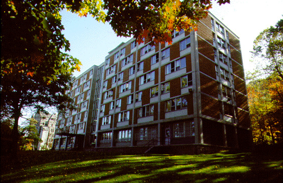 The upper residences are situated among the trees in Macdonald Park, a parcel of land on Mount Royal donated to McGill in 1911 by Sir William Macdonald, a major benefactor of the University. All of the residences except Royal Victoria College are located in Macdonald Park and are quite removed from the noise and commotion of the city. Originally, all of McGill's residences were designated for men with the exception of the Royal Victoria College, which was reserved for women. Today, RVC remains a women's residence while all of the other residences are co-educational. The upper residences, built in 1961 by the firm of Durnford, Bolton, Chadwick and Ellwood, consist of three separate housing buildings which surround a dining building. McConnell, Molson, and Gardner Halls are identical and provide housing for 672 students all together. Each seven-storey hall is split into two wings by a central stair and elevator core. Approximately thirty-six students are housed on each floor in single rooms, men in one wing, women in the other. There is a kitchenette on every floor and two large, common bathrooms, one per wing. Every room has cement block walls, a large window, and is equipped with built in furniture. There is a large common area, a television room, a study room, and a games room on the ground floor of each hall, and a laundry room in the basement. Other recreation is easily accessible because of the proximity of the Gymnasium and Stadium, tennis courts, the Winter Stadium, the Forbes' Field, and Mount Royal. The exterior of these three halls is of brick, tile, and cement, alternating in regular patterns to allow a window in every bedroom. The entire central stairwell of each building is encased in glass.

Bishop Mountain Hall, named after McGill's first principal, is the dining building in the centre of the residence halls. The two-storey, circular structure contains a reception and administration area on the first floor, and a large cafeteria and kitchen on the second floor. The circular shape was decided upon so that the kitchen and cooking facilities could be located in the core of the building. This allows the outer rim of the second floor to be used as a large circular eating area, entirely encased in glass and able to be divided into four sections by moving partitions.