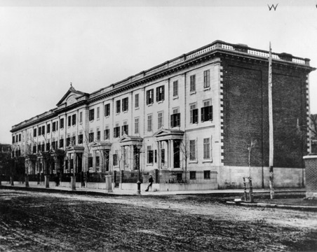 The Prince of Wales Terrace, named in honour of the visit of the Prince of Wales, was commissioned in 1860 by Sir George Simpson. The prestigious Terrace, once located on the north side of Sherbrooke Street at the corner of McTavish Street, consisted of a row of nine houses which presented a unified, Montreal limestone facade in the Classical Greek style. Doric columns, pilasters, window details, and pedimented porticoes were repeated uniformly on the exterior of each house with a pediment emphasizing the centre of the structure. The east and west ends were of brick and did not continue the themes of the facade. The interiors of all of the houses were as elegant as the exterior. In 1890, Sir William Macdonald, one of McGill's greatest benefactors, took up residence at number 3, Prince of Wales Terrace, which remained in his family until the building's destruction. Another resident of the Terrace was Sir William Peterson, a principal of McGill for whom Peterson Hall was named. In the late 1950s, the two easternmost units of the Prince of Wales Terrace were demolished to make way for the Royal Embassy Hotel. In 1971, McGill, who by that time owned the remaining houses, decided to use the site for the new Samuel Bronfman Building, and so the Prince of Wales Terrace was demolished.