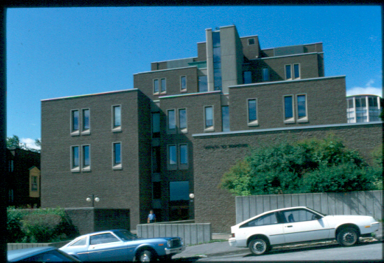 The Education Building was constructed in 1971 by the firm of Ellwood, Aimers, and Henderson in response to McGill's growing need for space. This seven-storey, brick and concrete structure, which stretches between McTavish and Peel Streets, is quite close to Duggan House, which is also devoted to the Faculty of Education. Although it is a modern building, its many tiered levels and brick facing allow it to blend with the older mansions around it with respect to shape and size. In this structure, more attention has been paid to detail than in other recent University projects. The Education Building is unusual in that it possesses a brick exterior, a feature which makes the edifice less austere than some of the other modern campus projects.