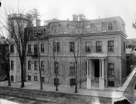 In 1886, Alfred Baumgarten, a wealthy, German sugar tycoon who loved horses and the hunt, yet also donated generously to Montreal's museum and hospitals, designed a house for his family on McTavish Street. Three out of eight houses of Rupert's Terrace were demolished to create a site for the Baumgarten house. This mansion, in the Square Mile area of the city, although it possessed a rather plain exterior, was replete with detail and decoration in its sumptuous interior. One of the outstanding features of this abode was the ballroom, built for Baumgarten's daughters who had just come of age. The ceiling, from which hung several chandeliers, was supported by marble columns, the floor was built on springs to give a boost to the dancers' feet, and a minstrel's gallery at one end was suspended from the ceiling with brass cords. The Gothic Gallery, which spanned two storeys of the house, was made to resemble a German hunting lodge and was covered by an immense, amber-coloured, stained glass skylight.

After Alfred Baumgarten's death in 1919, the house was occupied by his family. McGill bought it in 1926 as a residence for Sir Arthur Currie, who had just been made principal of McGill. In 1935, the house was renovated to become the McGill Faculty Club. At this time, the Gothic Gallery was split into two separate floors, the lower of which is now the main dining room, and the upper of which serves as the billiard room, still covered by the amber stained glass panels. Other than this, the structure of the building and the details of the interior have been preserved and the aura of another century still pervades the rooms.
