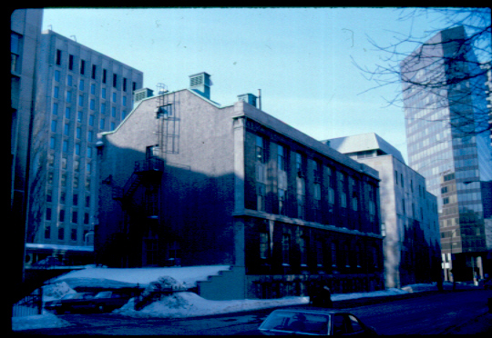 The Pulp and Paper Research Institute was built in 1927 by Percy Nobbs, Professor of Design at the School of Architecture at the time and architect of many other campus projects. This sturdy, three-storey stone structure, located on University Street just north of the Otto Maass Chemistry Building, nicely reflects Nobbs' 1931 extension to RVC just across the street. It demonstrates the wide range of ability of one architect.

Originally, the Institute was the home of the Cellulose Chemistry Department of McGill, the Pulp and Paper Division of the government's Forest Products Laboratories, and the research labs of the Pulp and Paper Association, all involved in the advancement of study of wood fibres. Large pulp mills and other mechanical equipment were installed in the building. The funding of the Institute was plentiful as it was backed by industry and the government. Many fine discoveries were made there, for instance, a means for mass producing artificial vanillin flavouring, found in many food products today. The Institute was also very active in making various strengths and types of paper during World War II. McGill has allowed many graduate researchers in Chemistry to earn their degrees here and so the University has benefited from the Institute as well.

Today the Pulp and Paper Research Institute continues its work and still shares its space with the Faculties of Chemistry and Chemical Engineering.