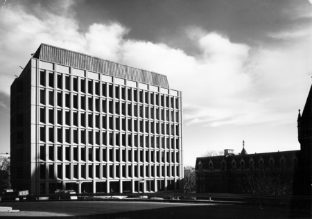 The Stephen Leacock Building was named after Stephen Leacock, a Professor of Economics from 1901 to 1944 and a well-known Canadian humorist and author. The edifice was built in 1965 by ARCOP, a firm contributed to by Affleck, Desbarats, Dimokopoulos, Lebensold, and Sise who were also responsible for the University Centre. At this time there were many building projects in progress all over the campus because of the dramatic climb in the enrolment of the University. Many of the faculties and departments had expanded beyond their spaces and needed room to grow, including the Faculty of Arts which had outgrown its ancestral home, the Arts Building. The area chosen for the new building had been, until then, the site of the McGill Observatory and of half of the Presbyterian College, whose remaining half is currently called Morrice Hall. The Leacock Building was originally planned as two towers, the second, which was found to be unnecessary and was never built, would have taken over the site of the remaining half of Morrice Hall, a charming Collegiate Gothic style structure.

Leacock is a ten-storey concrete structure that houses, on its lower three floors, twenty-four lecture rooms ranging in capacity from 30 seats to 200, not including the massive lecture room on the first floor which seats 650 students at a time. This large auditorium has no windows in it, to provide fewer distractions, and is half underground with the seats sloping in the same direction as the natural hillside. Since all of the lecture rooms are on the lower floors, they are easily accessible to students and keep the traffic to a minimum in the upper tower which is reserved for 125 offices served by elevators. The lower floors may be entered from the third floor terrace to the west, the second floor terrace to the south, the first floor street level, or from the Arts Building which is connected to Leacock from the east by a glass-walled corridor. Stairs, similar to those on the interior, connect the levels of the terrace.

The exterior is made of precast load-bearing concrete panels, each of which contains a sealed window. Concrete pillars help to support some of the projected portions of the structure, such as the protrusions over the ground floor glass walls. Care was taken to be economic with the lighting of the building and the first floor circulation passageways are lit, for the most part, by daylight which enters through the glass walls on the east and south sides. This durable structure currently houses the Departments of Humanities, Social Sciences, and Islamic Studies.