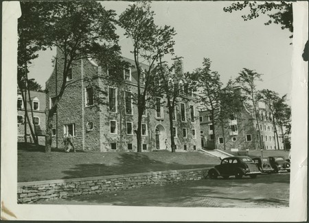 Douglas Hall was built in 1936 by Harold Fetherstonhaugh, who designed many other campus projects including the William and Henry Birks Building, and his current partner Alexander Durnford. It was named after James Douglas II who bestowed $200,000 on the University in 1915 with the request that the money be used to provide a men's residence.

Following the bequest, Percy Erskine Nobbs, a Professor of Design of the School of Architecture, had submitted plans in 1918 for a large residence situated just north of the Percival Molson Stadium, but they were not approved by the University.

Douglas Hall today stands unchanged from its original conception. The stone exterior encloses a central courtyard on three sides. The interior shows stone and wood floors and plaster and wood walls. The furnished rooms are organized into suites of three to five bedrooms opening onto a common living room. Each living room has its own custom designed fireplace. The hall is divided into eight houses of which six have three floors and two have four floors; each floor contains two suites with a common bathroom. Douglas also features a large dining hall with an exposed timber ceiling, a common room with a grand piano and several sofas for student recreation, and a quiet study lined with oak bookshelves and lit by globe shaped lights. At its opening, Douglas commanded a view of downtown extending to the St. Laurent and beyond. Today, the stands of the Percival Molson Stadium have been extended and block much of this view, except from the top floors.