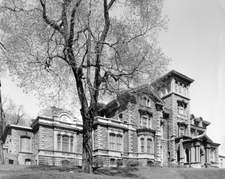 In 1863, Sir Hugh Allan, the Scottish founder and president of the Allan Lines Shipping Company, commissioned Victor Roy and John Hopkins to construct a house that reflected his wealth and power. This Italianate, villa-style mansion was named Ravenscrag after a Scottish castle and was located at the top of McTavish Street with an imposing view over the entire city. The house, which is divided into many wings, had an asymmetric facade dominated by a large, solid tower which dominates the main entrance. The thirty-four room interior featured a different architectural style in each room. The entrance hall and dining room had Italian themes, the ballroom was French, and the oak-paneled library with ornate furniture was distinctly Victorian. Since the Allans were interested in horses, the fourteen acre estate possessed one of the finest stables on the Square Mile, the entrance of which was marked by a sculpted horse's head.

After Sir Hugh Allan died in 1882, his son and daughter-in-law, Sir Montagu and Marguerite, respectively, inherited Ravenscrag. They enlarged the house, redecorated in a more elegant and lavish style, employed several live-in servants, and filled the stable with prize thoroughbreds at the request of Sir Montagu, the president of the Jockey Club. After Sir Montagu's death, Lady Allan gave Ravenscrag to the Royal Victoria Hospital in 1940. It was renamed the Allan Memorial Institute in 1943. To serve the present needs as a psychiatric hospital and research institute, the interior of the building has been altered and many additions have been made to the exterior.